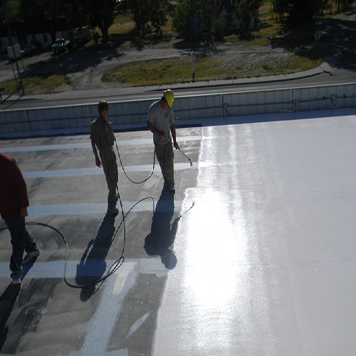 Men Spraying Acrylic Coating on a Roof