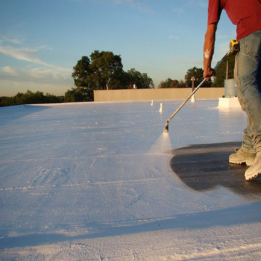 A Commercial Roofing Contractor Putting a Coating on a Roof